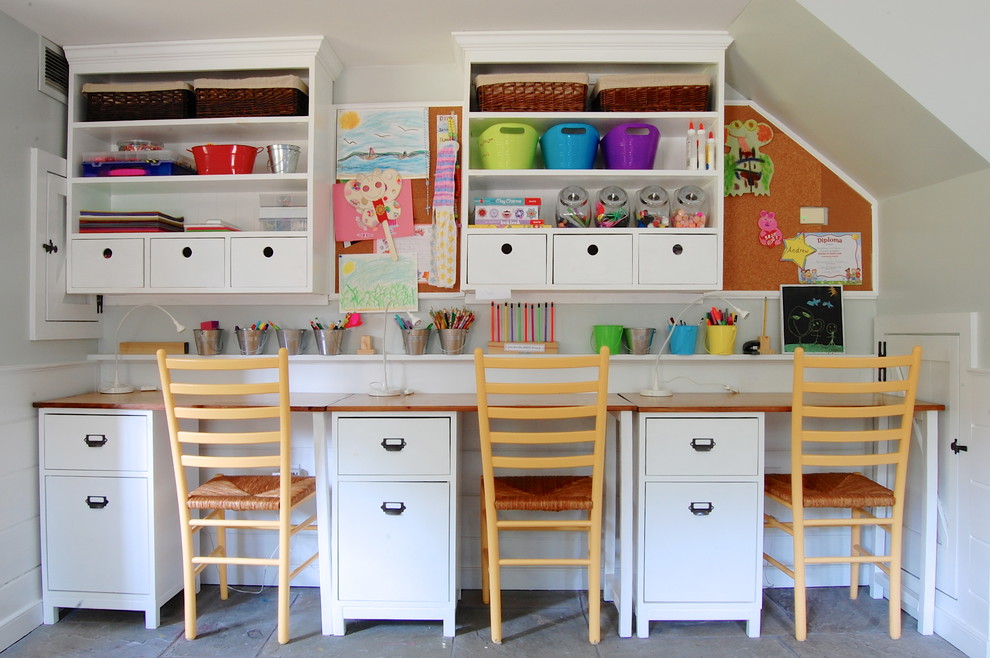 Example of a farmhouse gender-neutral kids' study room design in New York with white walls