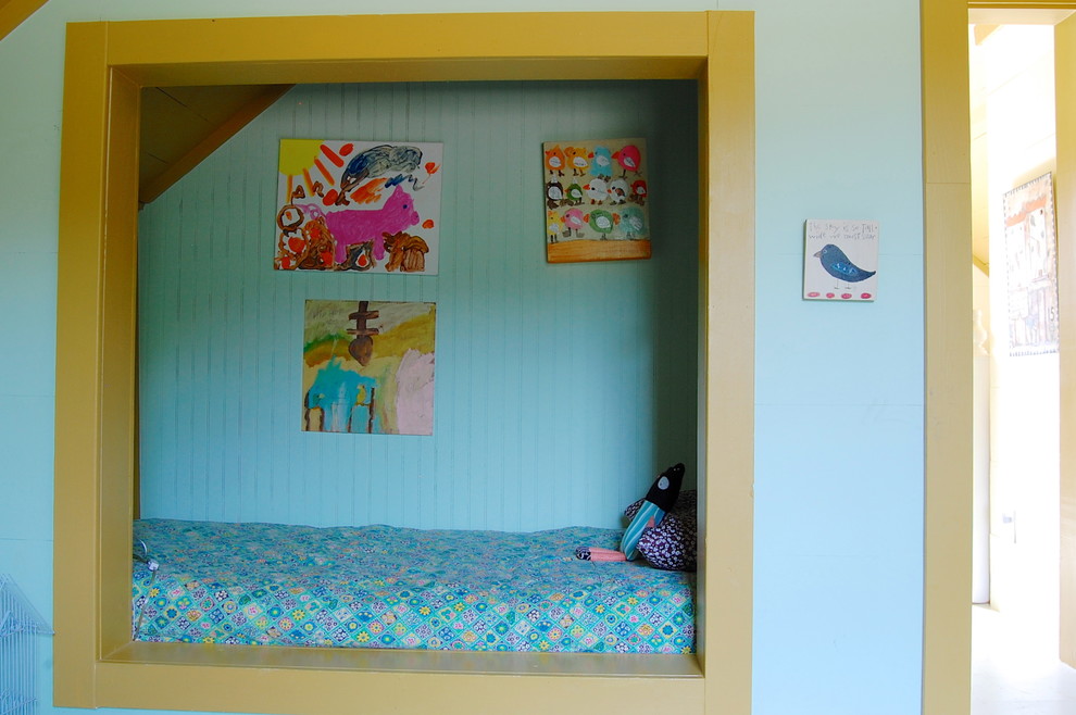 Design ideas for a farmhouse kids' bedroom for girls in New York with blue walls.