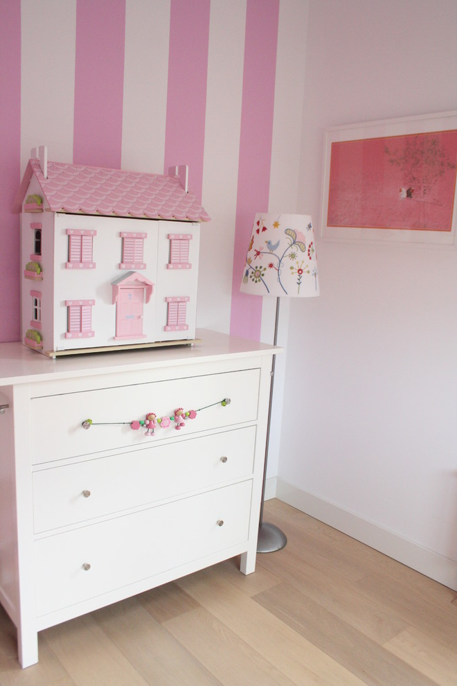 Photo of a contemporary kids' bedroom for girls in Amsterdam with multi-coloured walls.