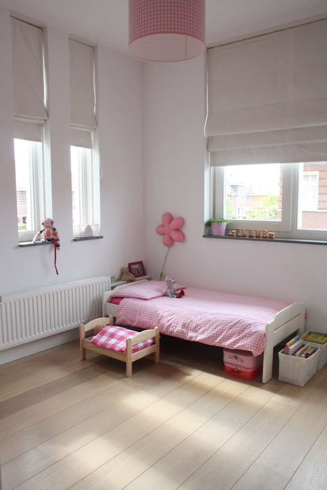 Contemporary kids' bedroom for girls in Amsterdam.