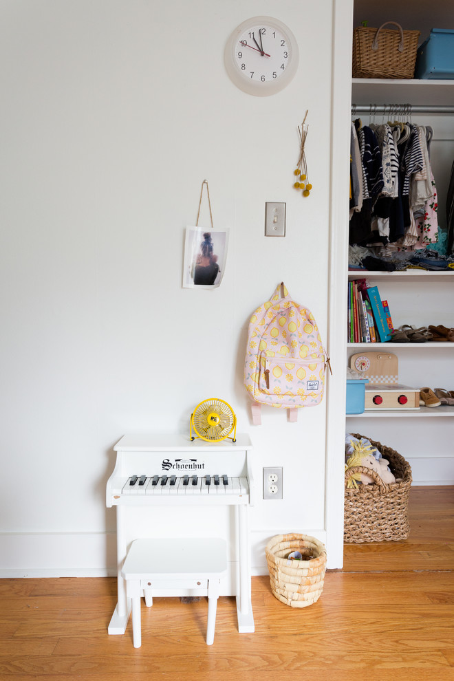 Eclectic girl kids' room photo in Kansas City with white walls