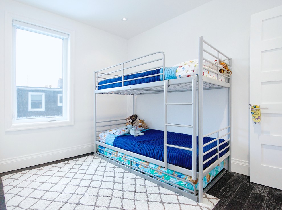 Example of a trendy kids' room design in Toronto with white walls