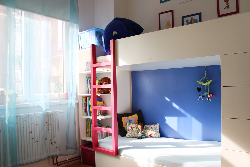 This is an example of a contemporary kids' bedroom for boys in Other.