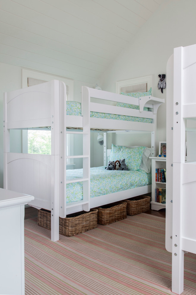 Inspiration for a coastal gender-neutral kids' room remodel in Boston with white walls