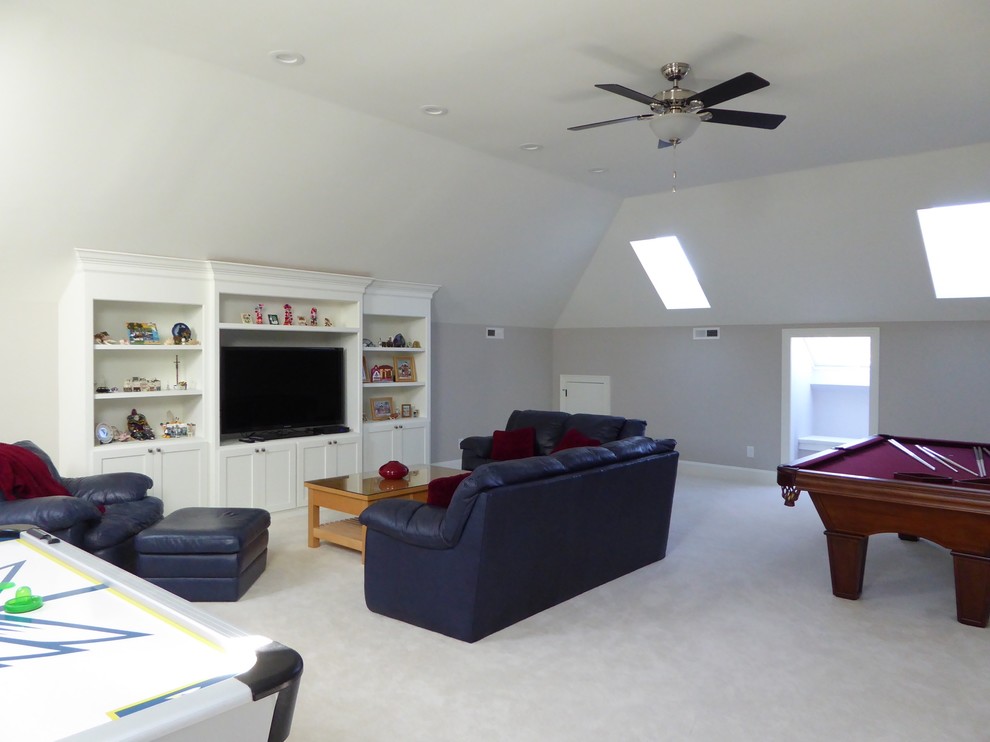 Example of a large transitional gender-neutral carpeted kids' room design in Raleigh with gray walls