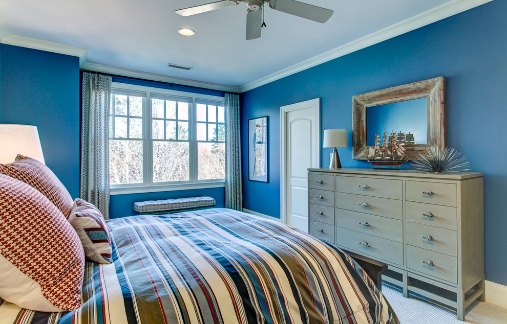 Inspiration for a medium sized traditional children’s room for boys in Raleigh with blue walls and carpet.