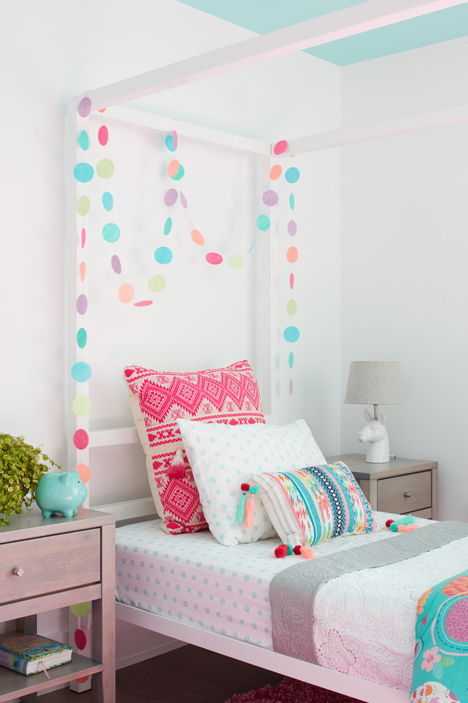 This is an example of a coastal children’s room for girls in Manchester with white walls.