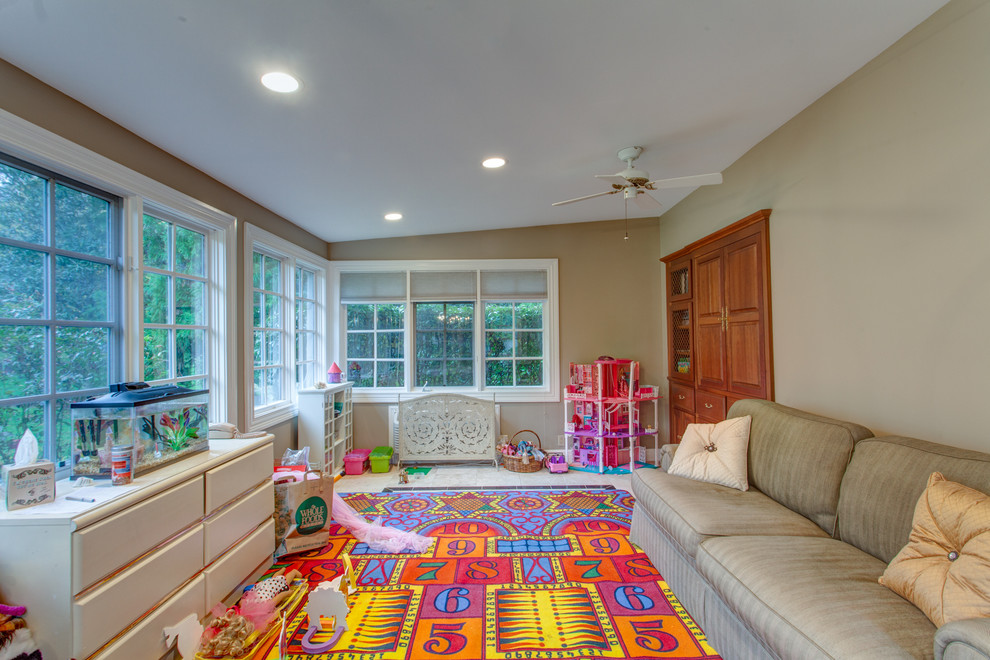 Example of a large classic travertine floor playroom design in Nashville