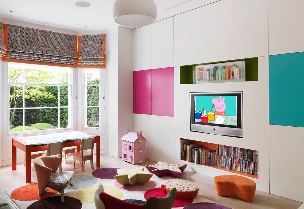 Contemporary playroom in Los Angeles with white walls, light hardwood flooring and beige floors.