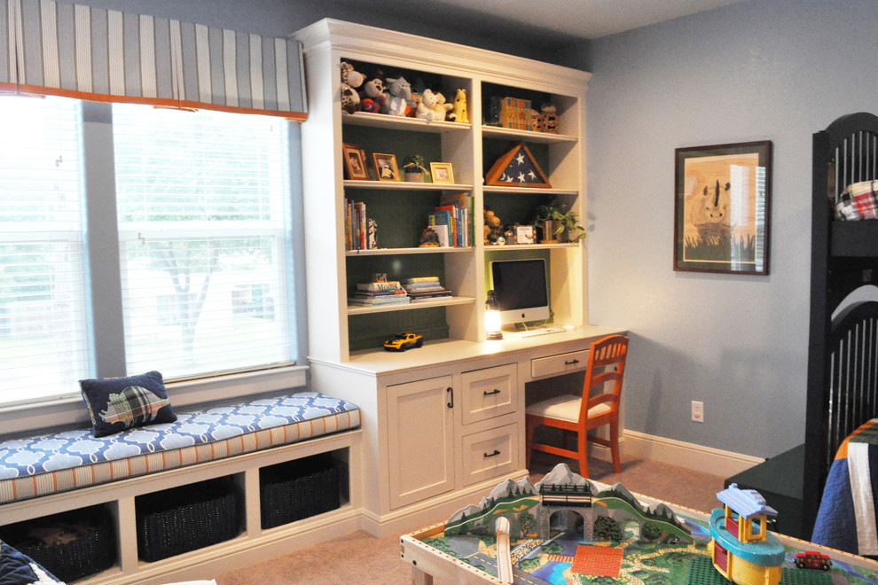 Example of a mid-sized transitional boy carpeted kids' room design in Denver with blue walls