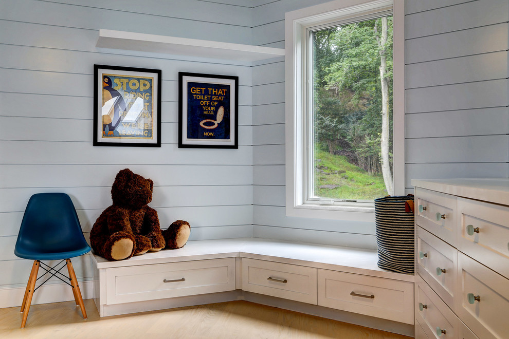 Mid-sized farmhouse gender-neutral light wood floor and beige floor kids' room photo in New York with white walls