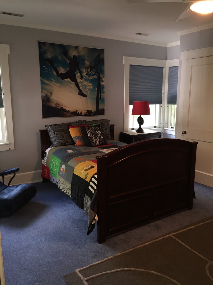 Medium sized traditional children’s room for boys in Chicago with grey walls, carpet and blue floors.