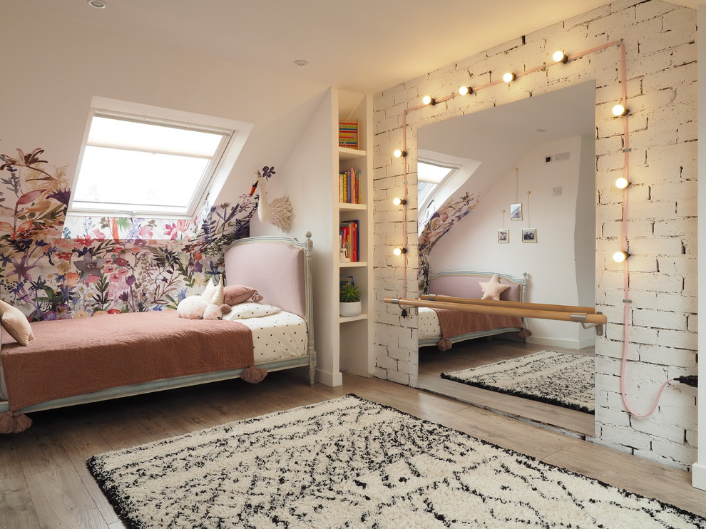 Inspiration for a medium sized contemporary children’s room for girls in Edinburgh with multi-coloured walls, laminate floors and beige floors.