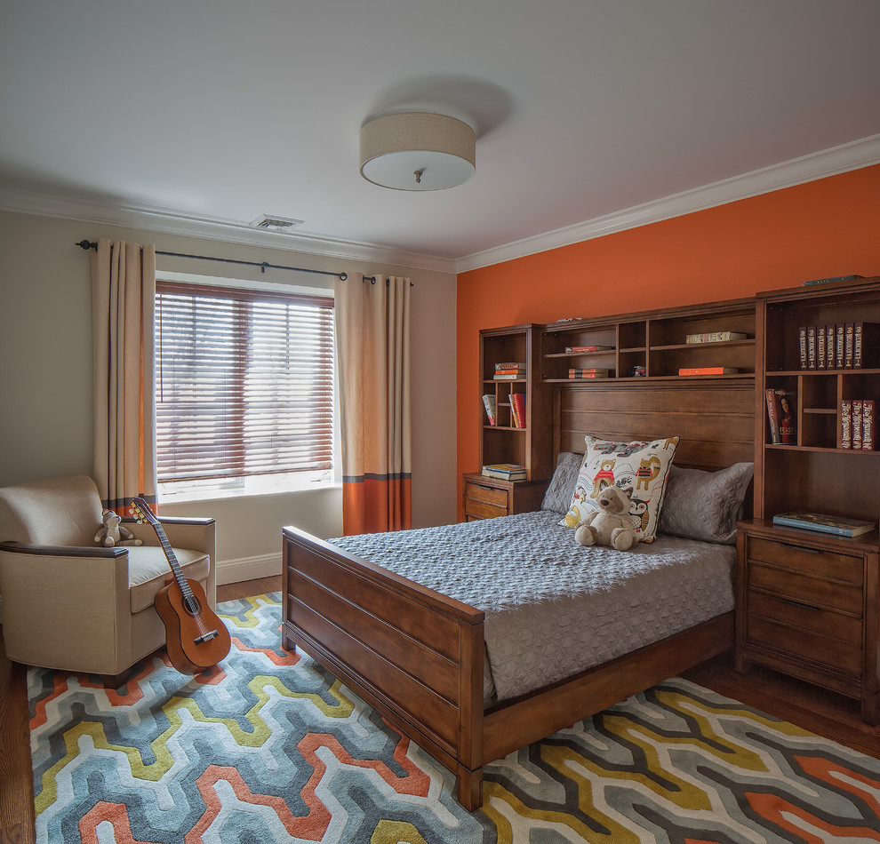 На фото: большая детская в стиле неоклассика (современная классика) с спальным местом, оранжевыми стенами, паркетным полом среднего тона и коричневым полом для ребенка от 4 до 10 лет, мальчика с