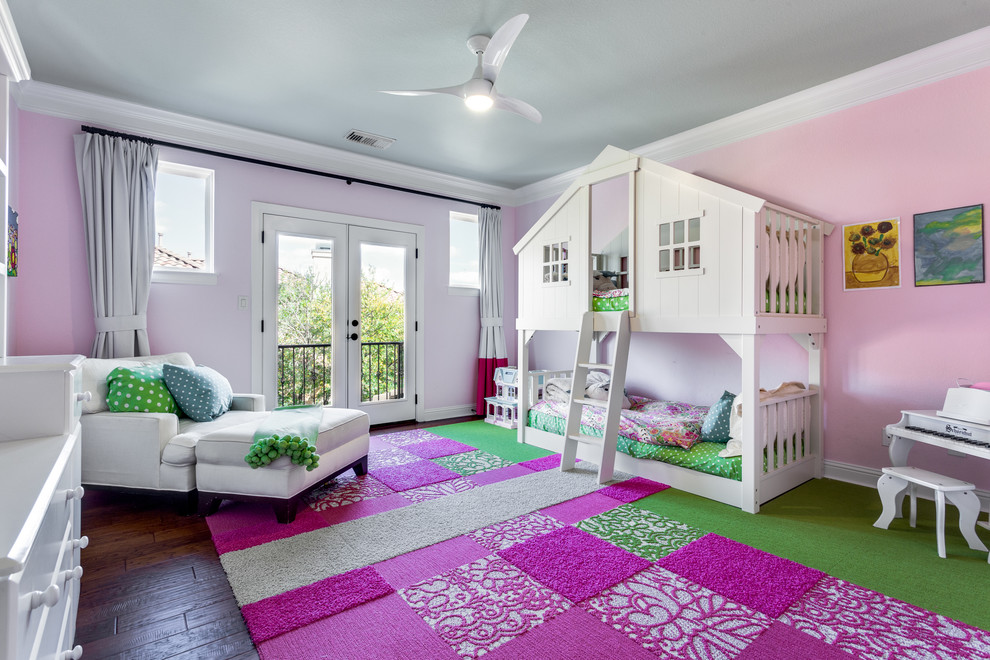 Medium sized contemporary children’s room for girls in Austin with pink walls and dark hardwood flooring.