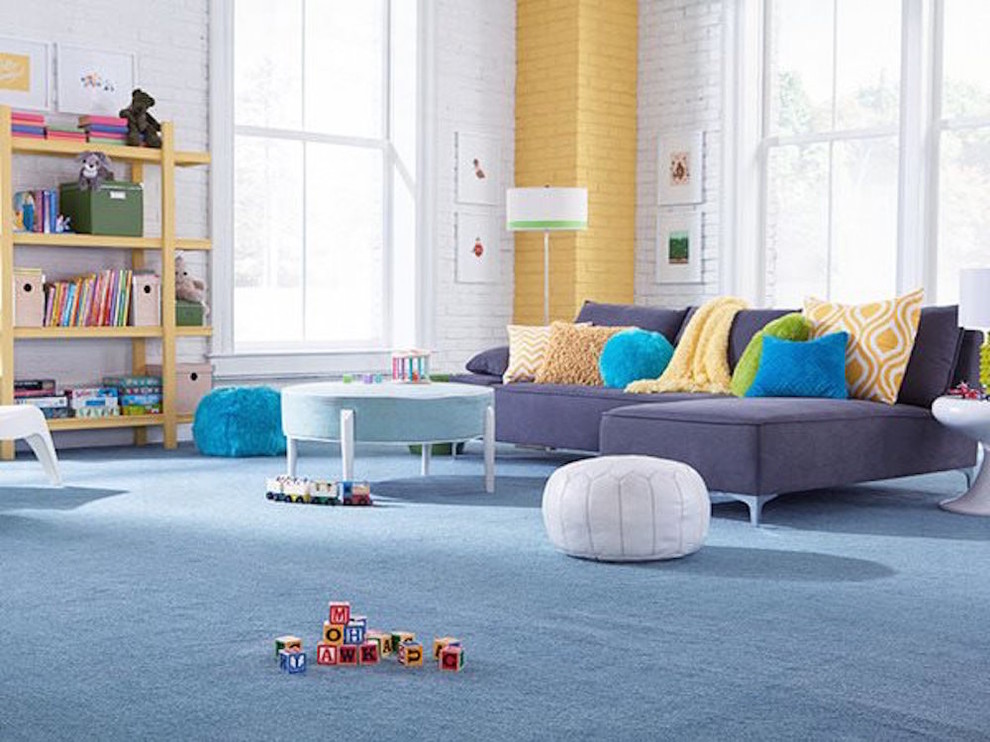 Playroom - gender-neutral carpeted playroom idea in Other with multicolored walls