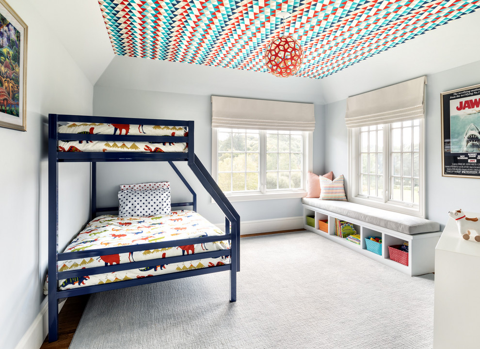 Photo of a classic children’s room for boys in New York with grey walls, dark hardwood flooring and brown floors.