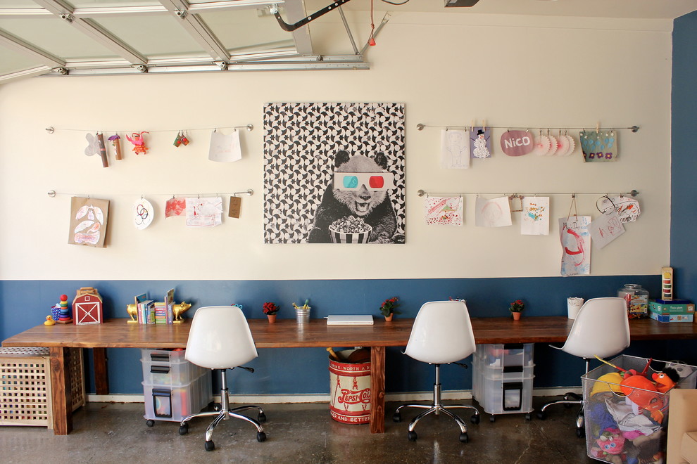 Eclectic gender-neutral concrete floor kids' room photo in Los Angeles with multicolored walls