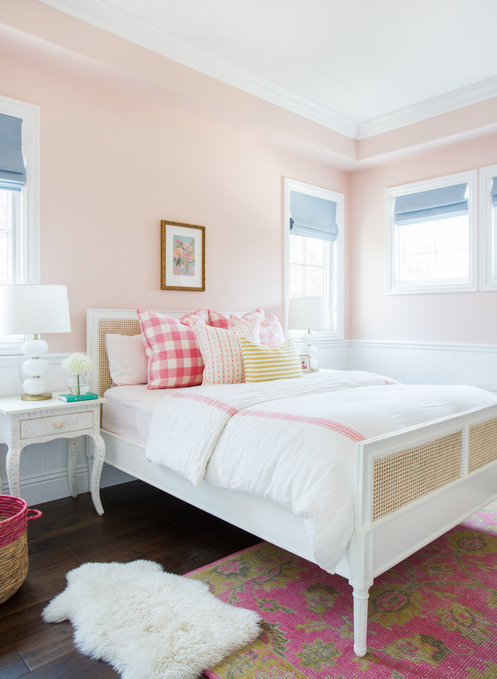 Kids' bedroom - transitional girl dark wood floor kids' bedroom idea in Los Angeles with pink walls
