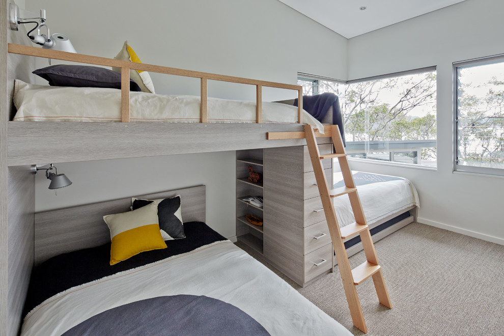 Imagen de dormitorio infantil nórdico con paredes grises y moqueta