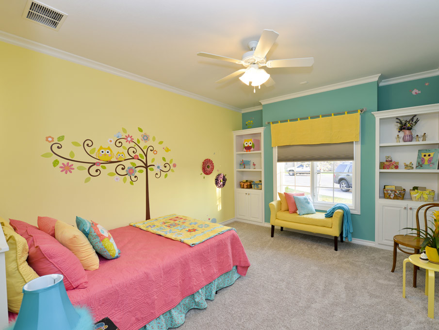 Mid-sized eclectic girl carpeted kids' room photo in Austin with multicolored walls