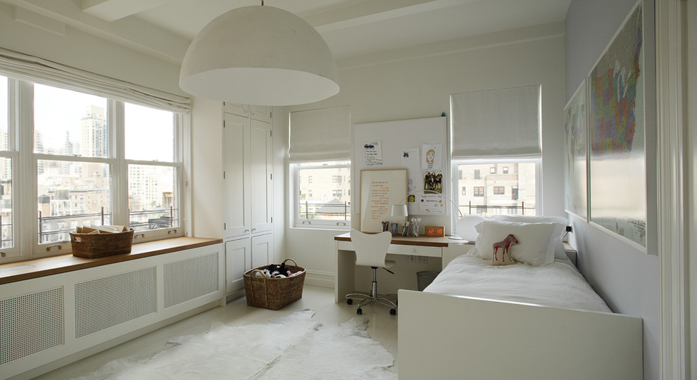 Kids' room - modern gender-neutral kids' room idea in New York with white walls