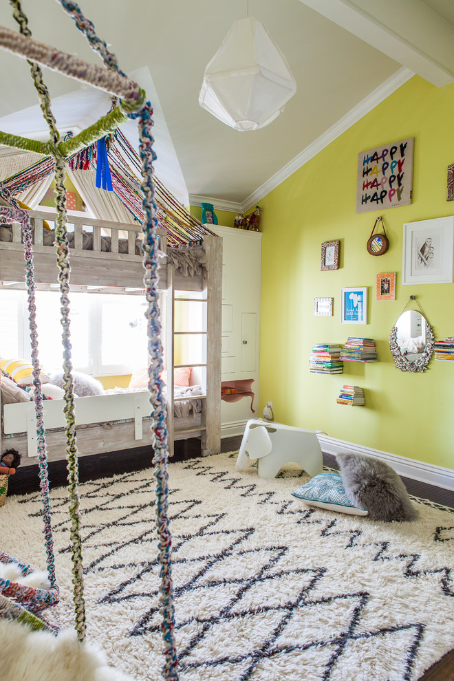 Classic gender neutral kids' bedroom in Los Angeles with green walls.