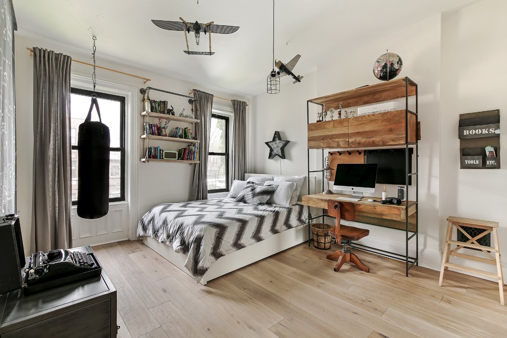 Inspiration for a large traditional teen’s room for boys in New York with white walls, light hardwood flooring and beige floors.