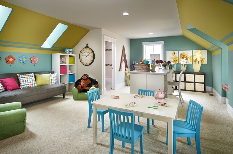 Transitional gender-neutral playroom photo in Denver with blue walls