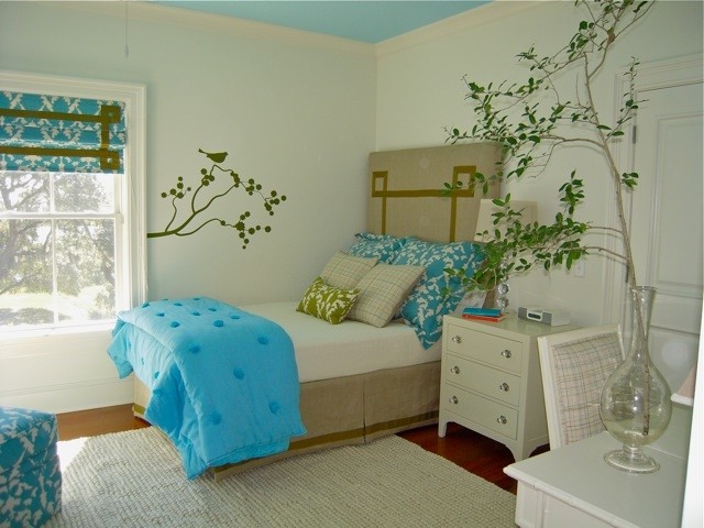 Photo of a medium sized contemporary teen’s room for girls in Charleston with white walls and medium hardwood flooring.