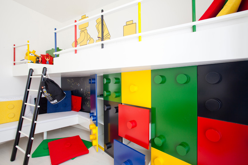 Photo of a modern kids' bedroom for boys in Other with white walls.