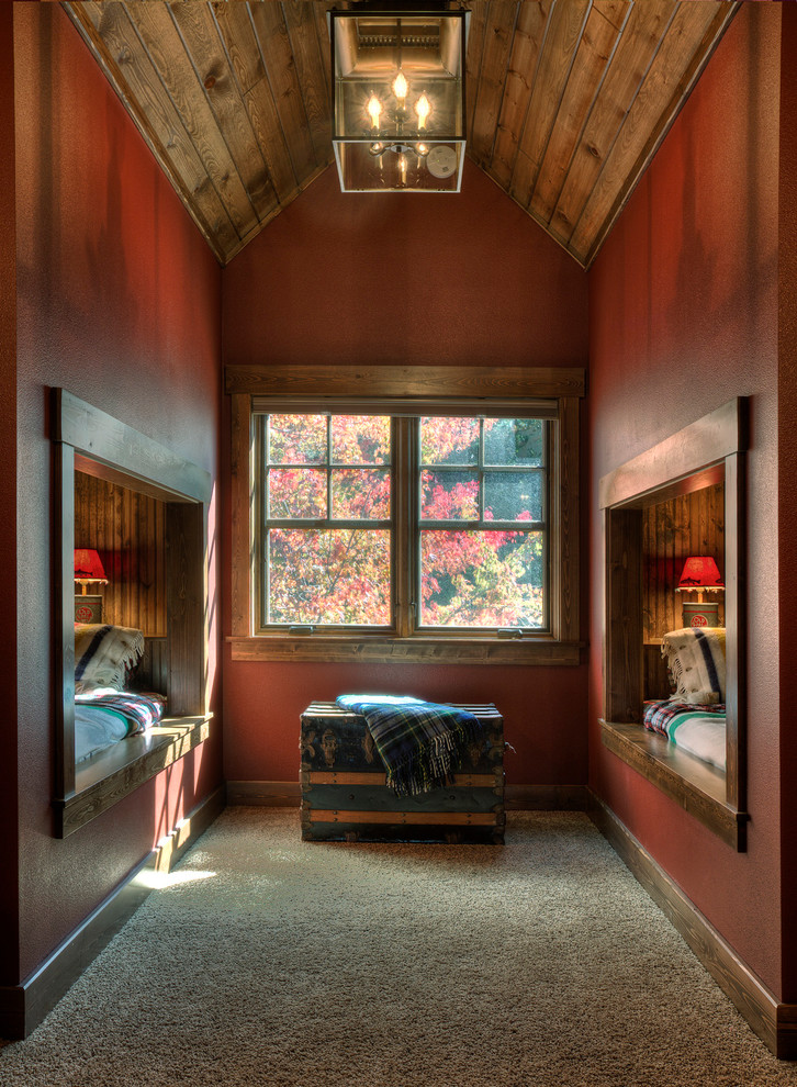 Cette photo montre une chambre d'enfant montagne avec un mur rouge, moquette et un sol gris.
