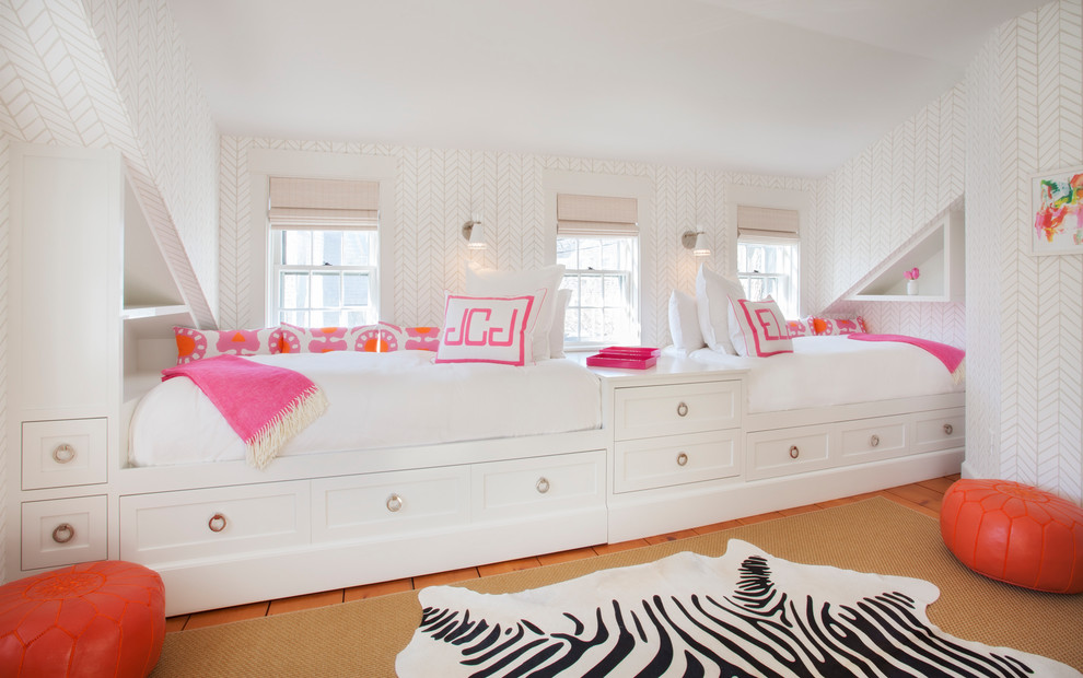 This is an example of a beach style kids' bedroom for girls in Boston with multi-coloured walls.