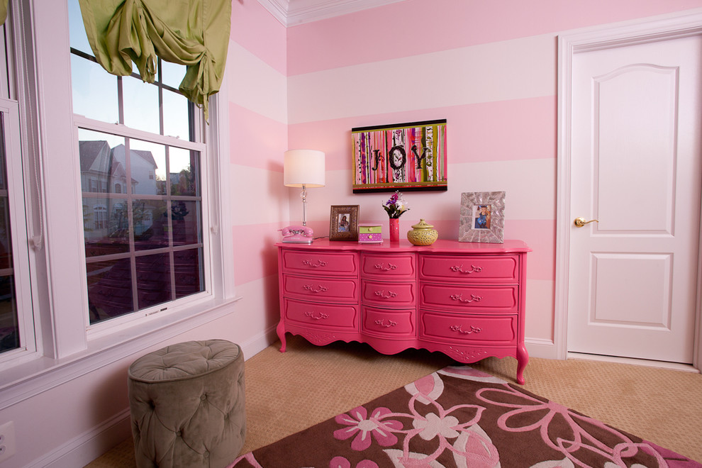 Example of a trendy girl carpeted kids' room design in DC Metro with pink walls