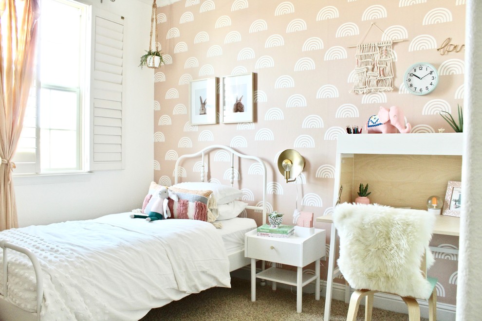 Mid-sized transitional girl carpeted and beige floor kids' room photo in Sacramento with pink walls