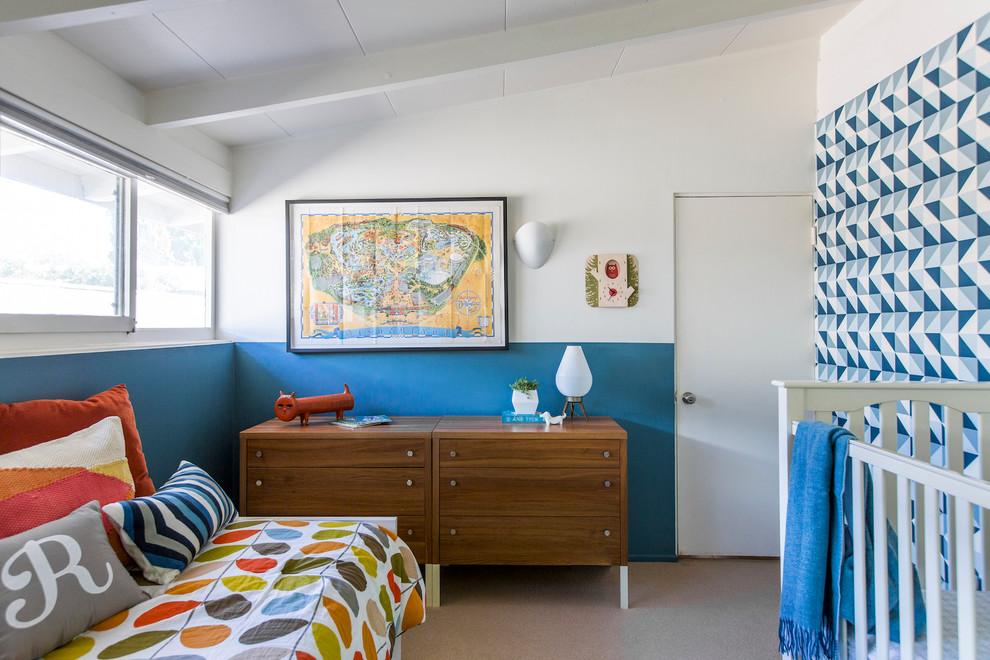 Example of a mid-sized 1960s boy carpeted kids' room design in Los Angeles with multicolored walls