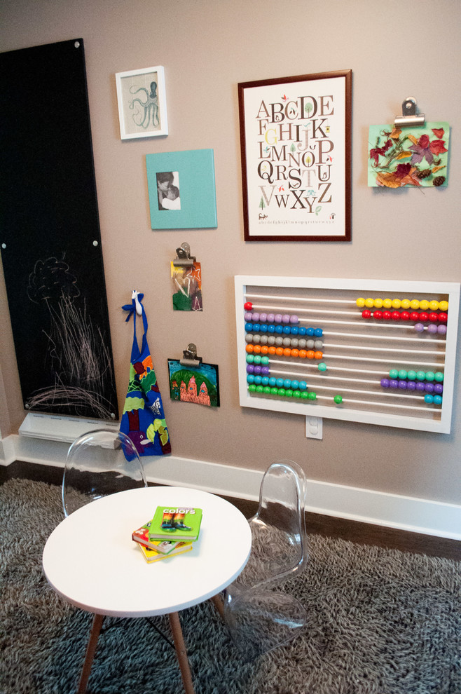 Example of a mid-sized eclectic gender-neutral dark wood floor and brown floor kids' room design in Seattle with beige walls
