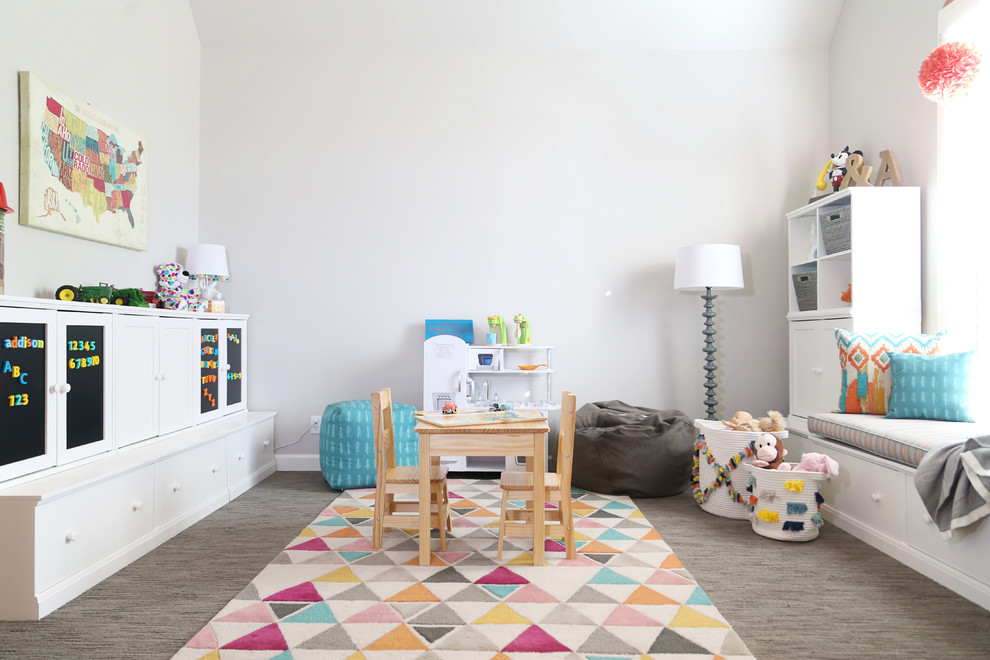 Example of a mid-sized transitional gender-neutral carpeted and brown floor kids' room design in Other with beige walls