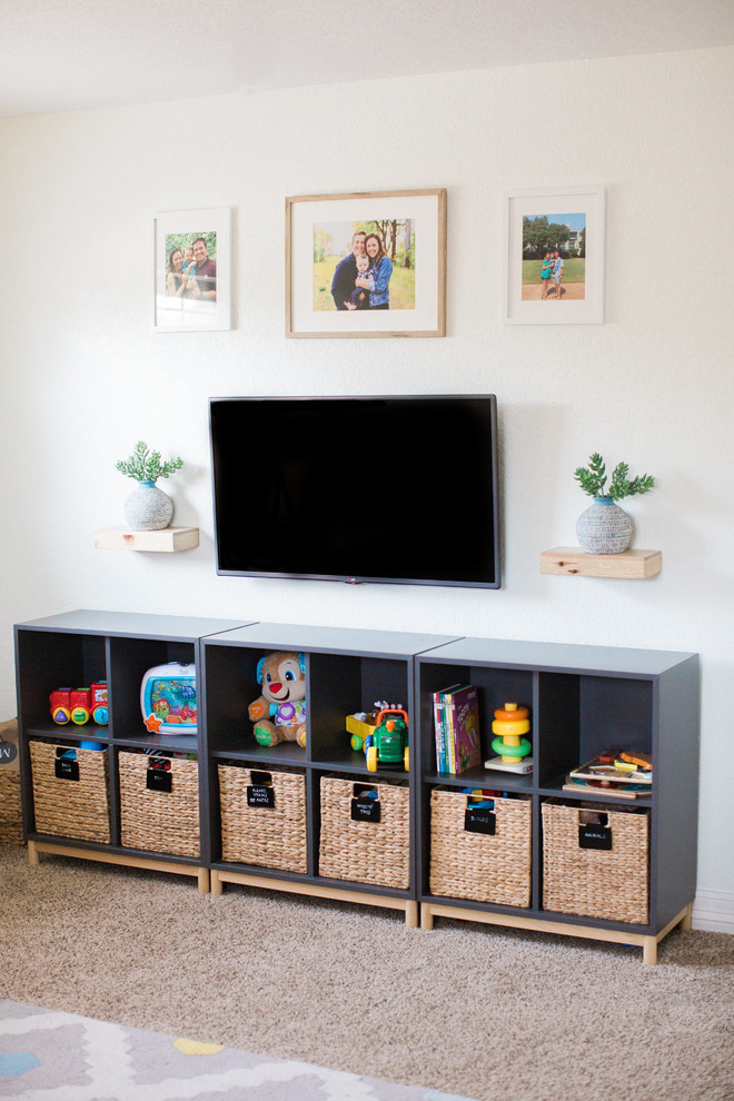 Example of a large transitional gender-neutral carpeted kids' room design in Austin with white walls