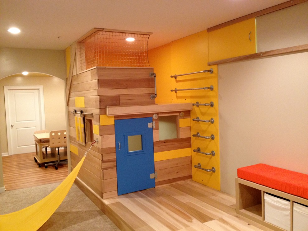 Photo of a large bohemian kids' bedroom for boys in Baltimore with beige walls and medium hardwood flooring.