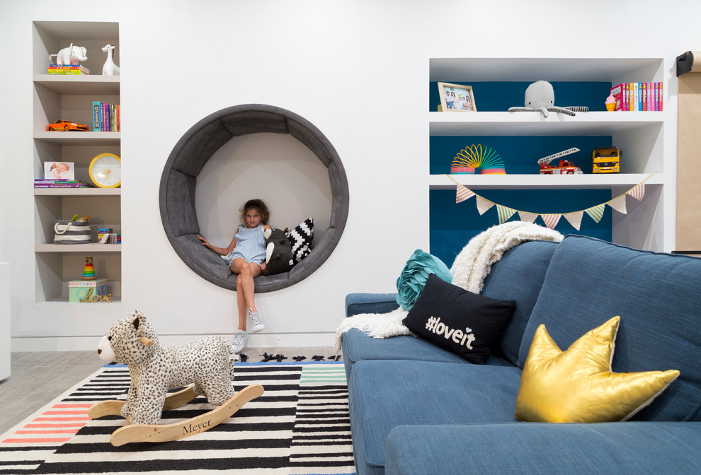 Example of a large trendy gender-neutral porcelain tile and gray floor kids' room design in Miami with white walls