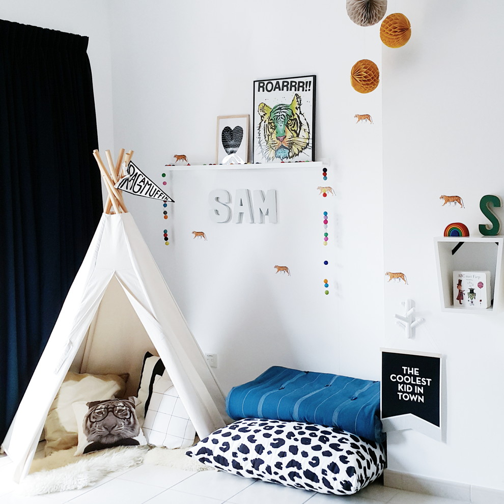 Design ideas for a small classic playroom for boys in Vancouver with white walls and white floors.