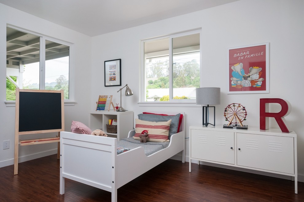 Example of a transitional gender-neutral dark wood floor kids' bedroom design in San Francisco with white walls