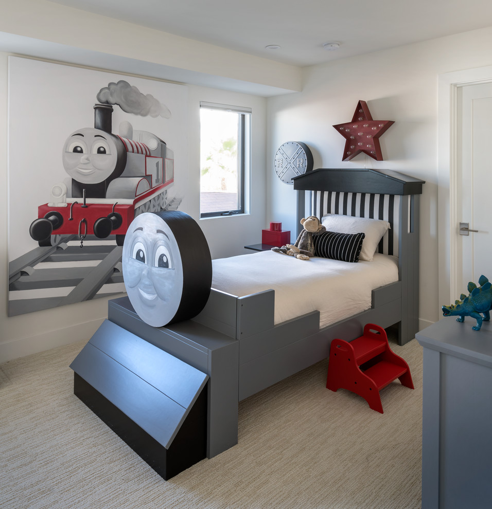 Classic children’s room for boys in Austin with white walls and carpet.