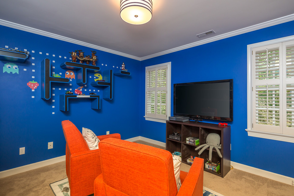 Transitional boy carpeted and beige floor kids' room photo in Raleigh with blue walls