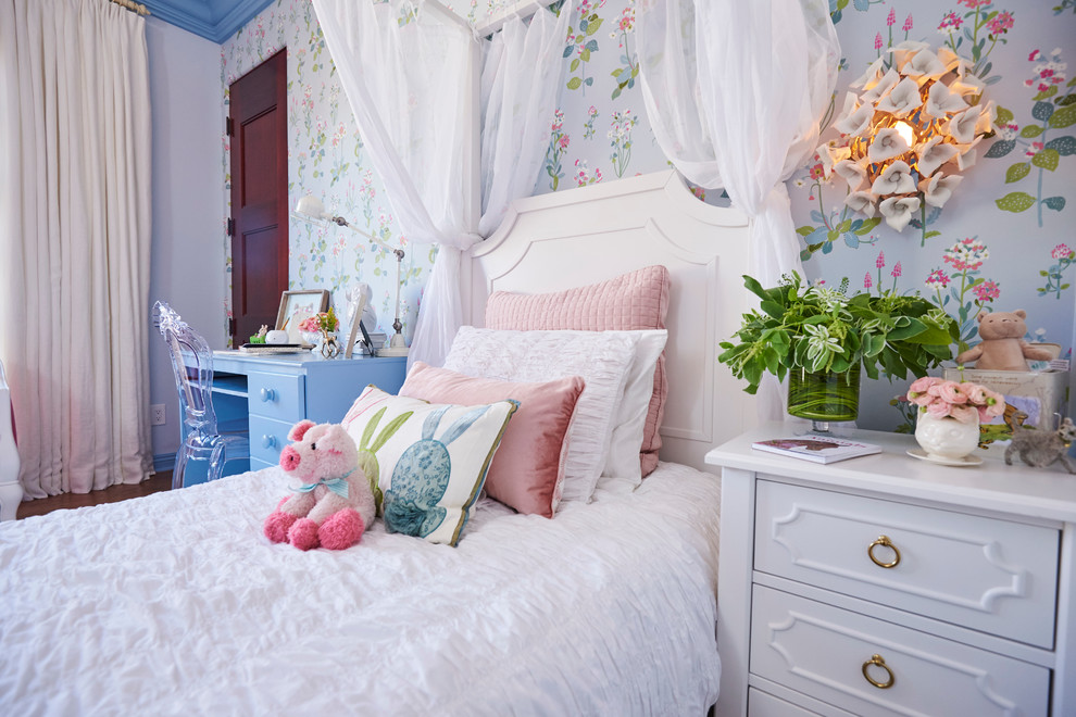 Inspiration for a large romantic children’s room for girls in Los Angeles with blue walls and carpet.