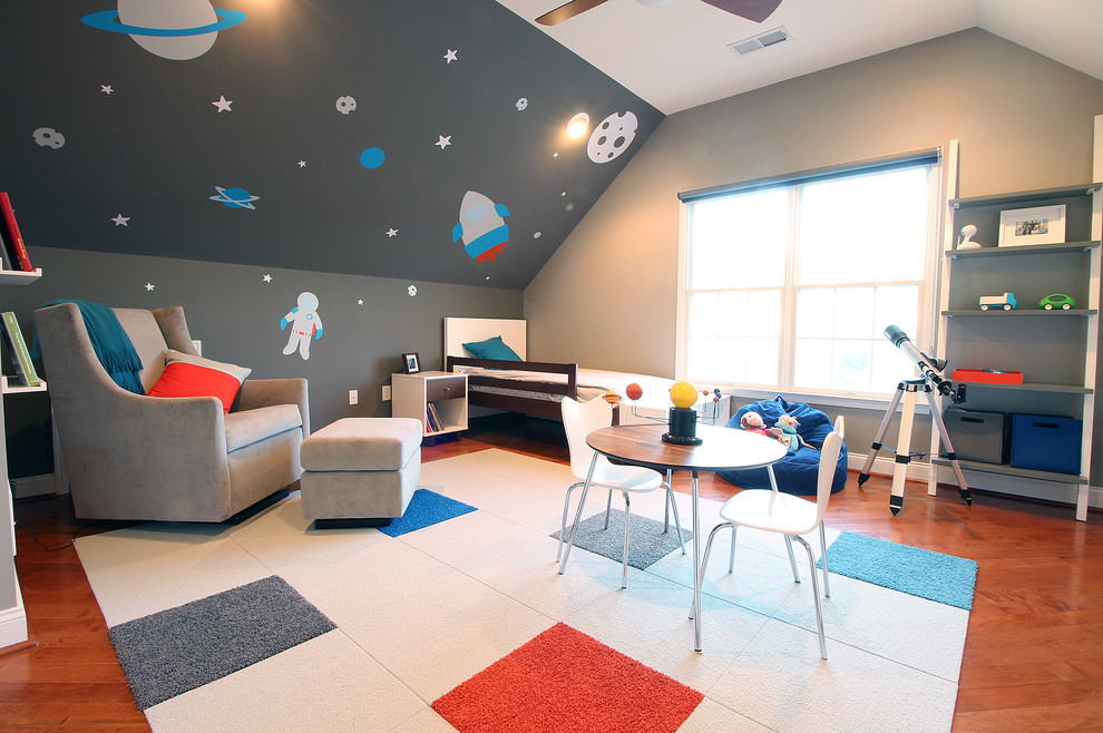 Example of a mid-sized trendy boy medium tone wood floor kids' room design in New York with gray walls