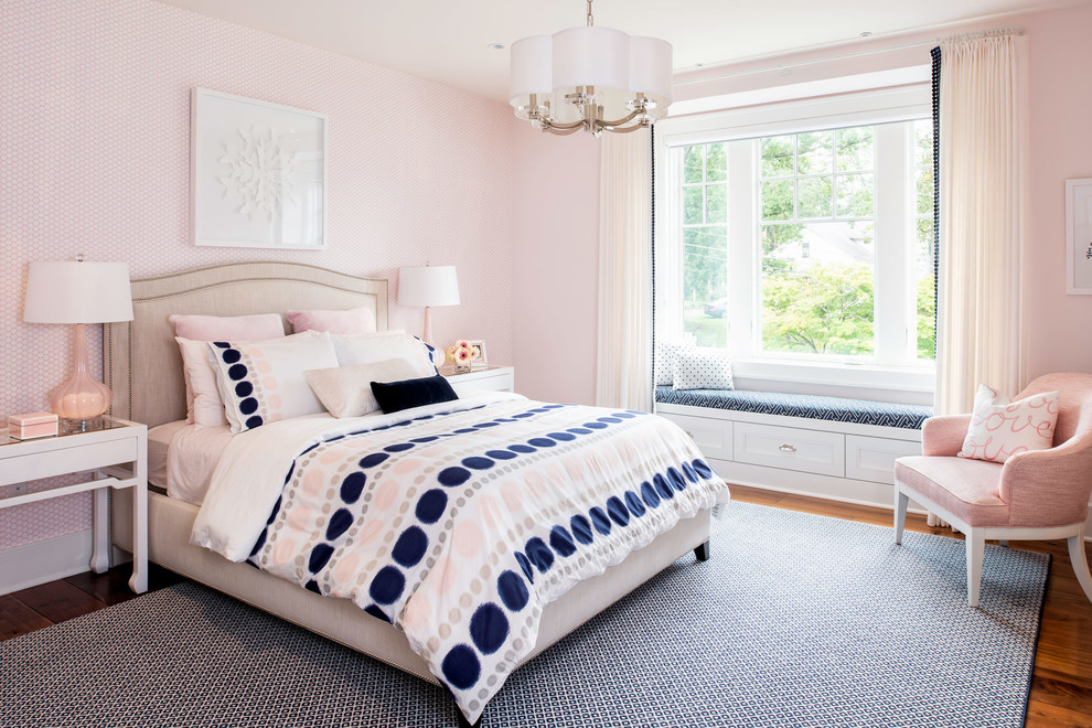 Large classic teen’s room for girls in DC Metro with medium hardwood flooring and pink walls.