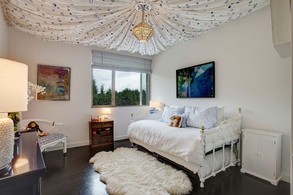Example of a trendy girl dark wood floor kids' room design in Seattle with white walls