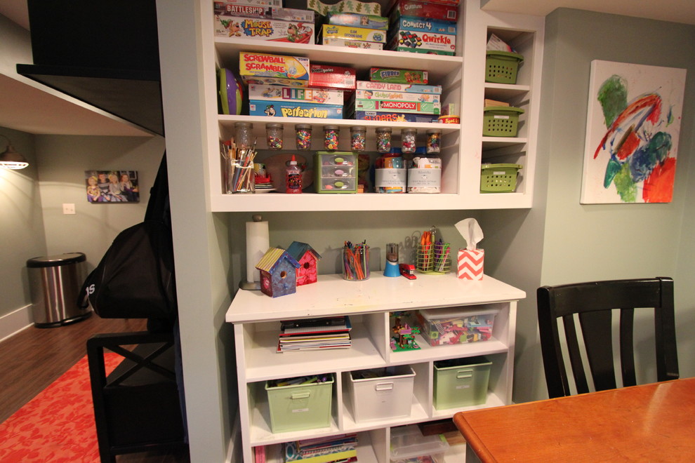 Small classic gender neutral playroom in Omaha with grey walls.